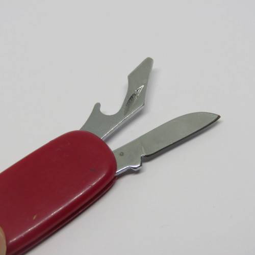 Vintage pocket knife and opener with pocket scissors
