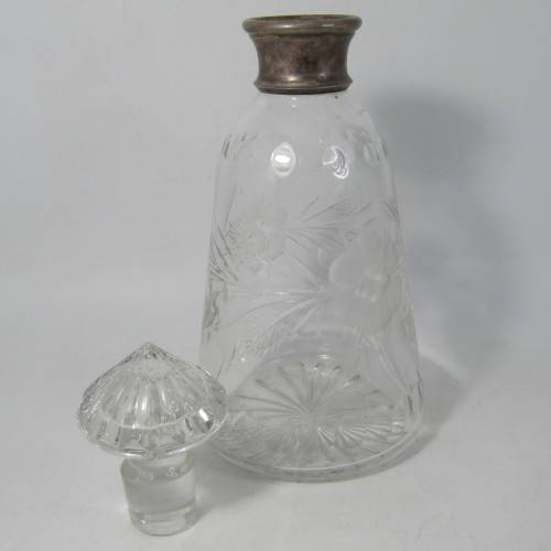 Beautiful vintage glass decanter with silver plated rim