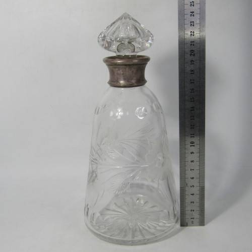 Beautiful vintage glass decanter with silver plated rim