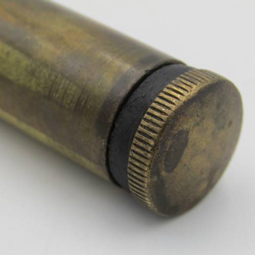 Vintage .303 brass oil bottle with markings on botton