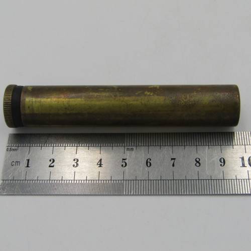 Vintage .303 brass oil bottle with markings on botton