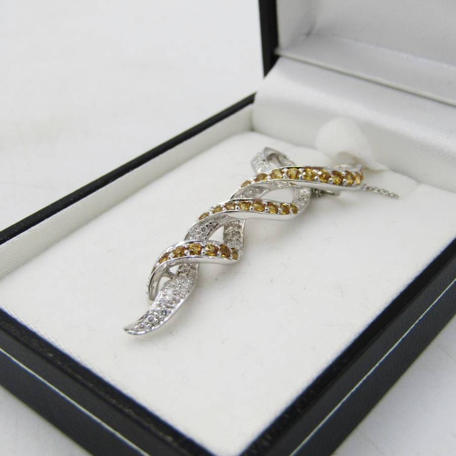 18kt White gold pendant with diamonds and yellow sapphires with 9kt white gold necklace