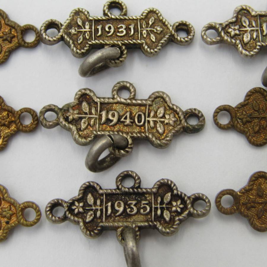 Lot of 9 St John`s Ambulance date labels - some silver