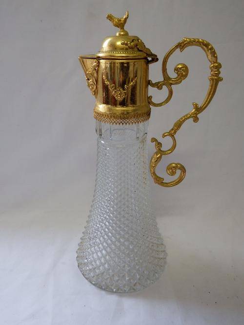 Vintage glass decanter with metal lid