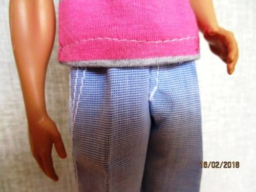 Ken - Barbie - light blue pants plus pink and grey stripe T-shirt.