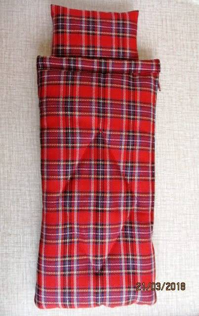 Ken sleeping bag in red check.