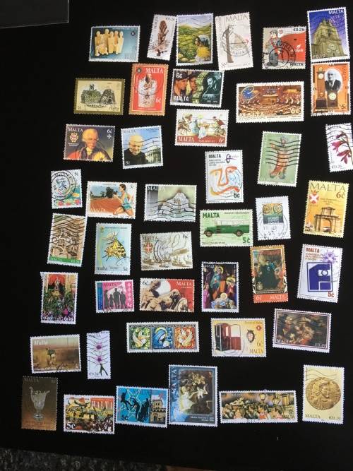 43 used Malta stamps on a stock card