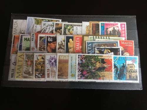 43 used Malta stamps on a stock card
