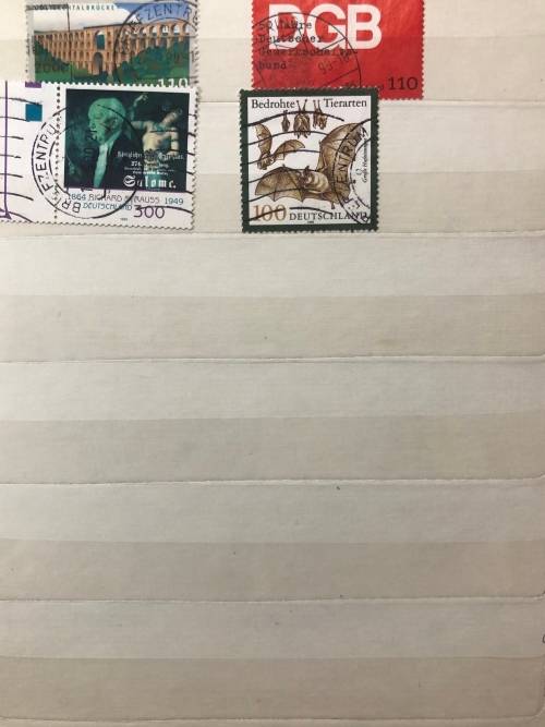 Germany 1990 - 1999 used stamps in A5 album (150+ stamps)