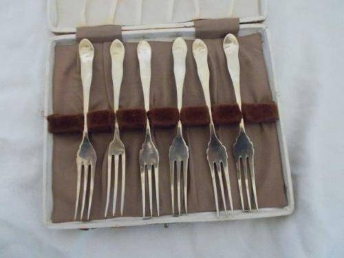 boxed silver plated pickle forks ? or fruit forks