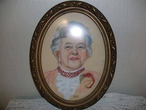 Lovely vintage oval gilded frame with portrait of grandma