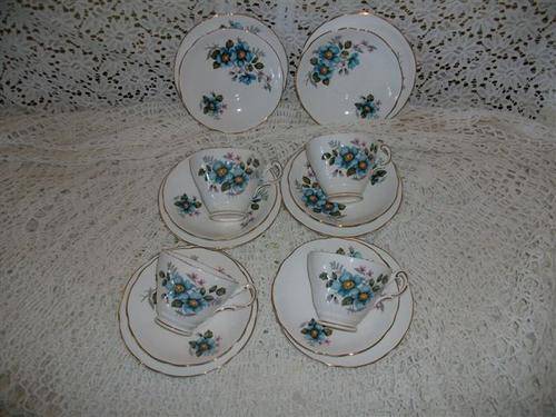 Pretty blue flowers tea cup trio's with extra saucers and side plates