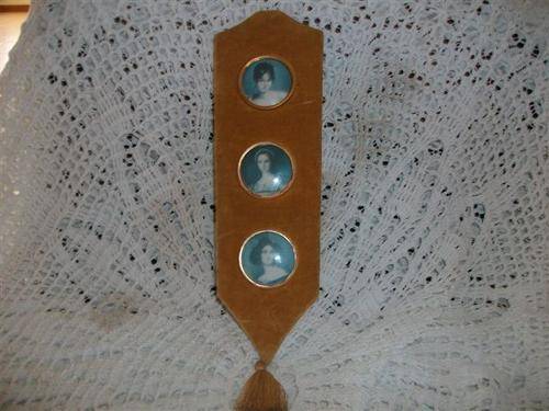 collectable wall hanging of miniature prints framed