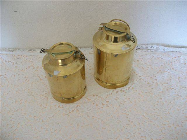 ornamental pair of brass milk containers