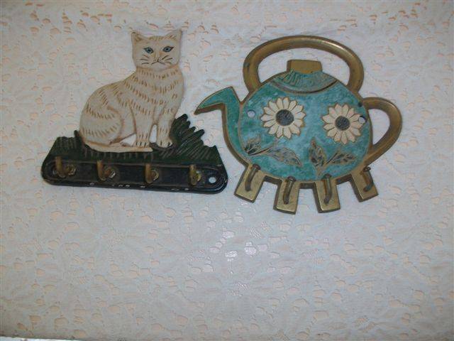 Two brass house hold key holders