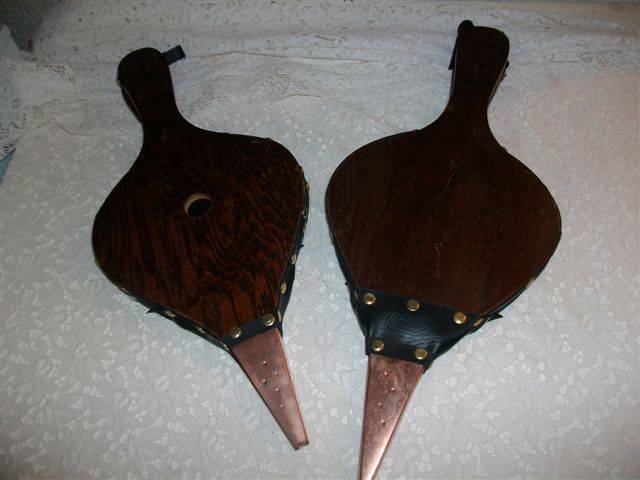 A pair of wooden fire bellows