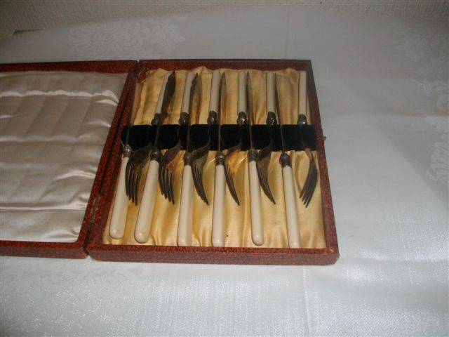 cased bone handle fish knifes and forks