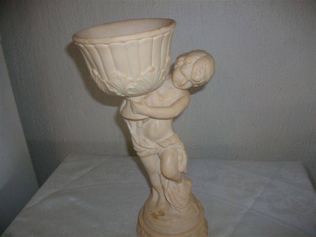 Large cherub holding a pot resin figurine