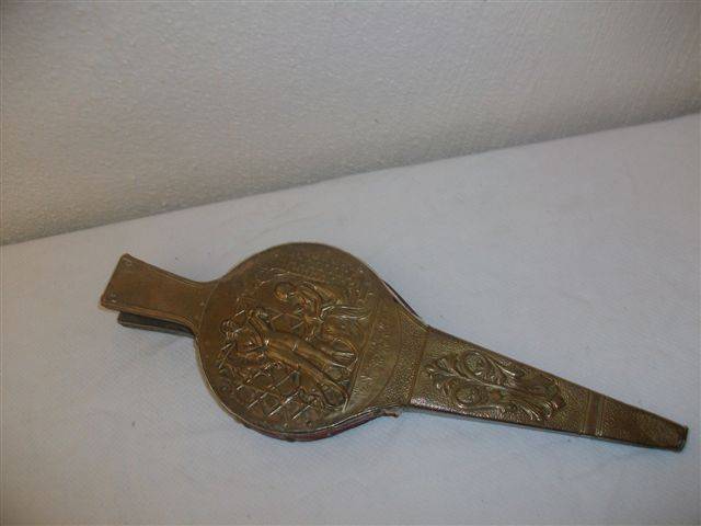 A pair of brass fire bellows