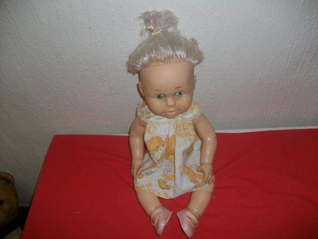 Collectable ? hard plastic wet doll in need of tlc