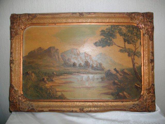Vintage ornate Victorian style frame with vintage oil on board mountain scene