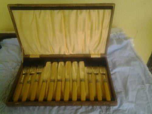 Boxed vintage fish bone handle knife and fork set