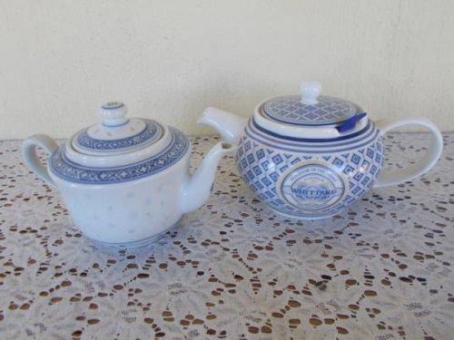 Two oriental blue and white tea pots