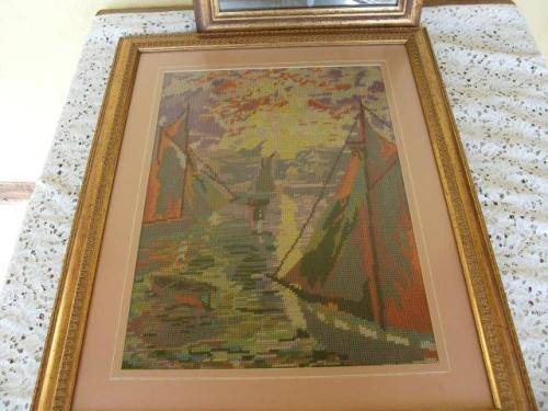 stunning boating scene tapestry behind glass