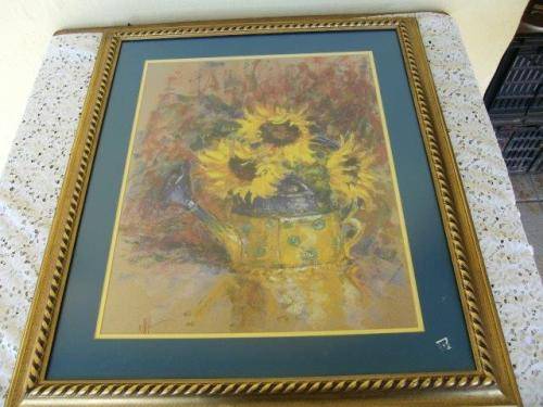 stunning framed print of sunflowers behind glass