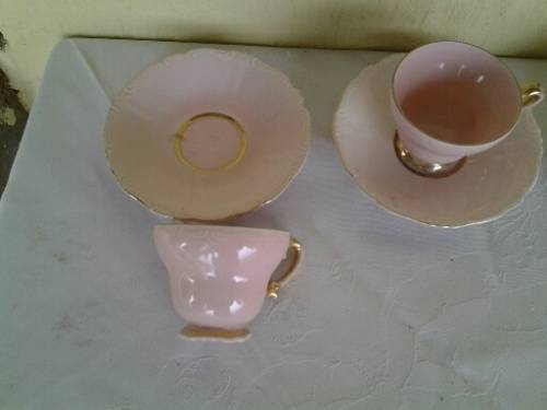 a lot of five pretty small pastel pink espresso coffee cups and saucers