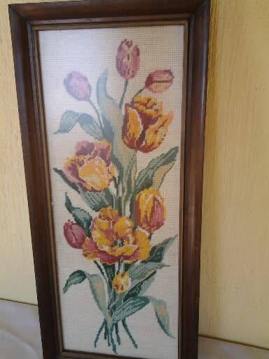 bright and colorful framed behind glass floral tapestry