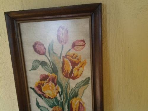 bright and colorful framed behind glass floral tapestry