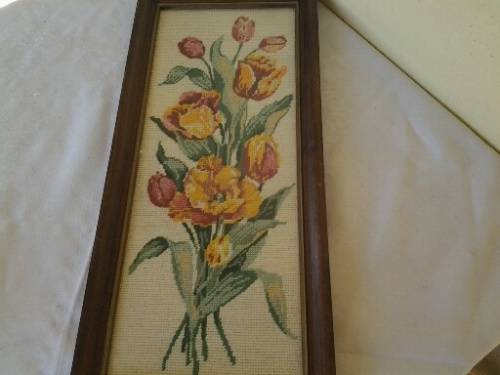 bright and colorful framed behind glass floral tapestry