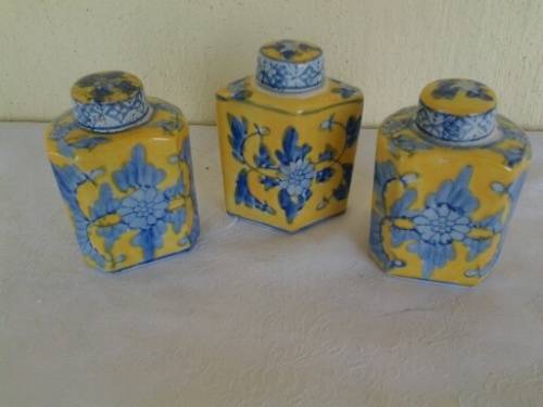 three small oriental looking decorative mini porcelain jars with lids
