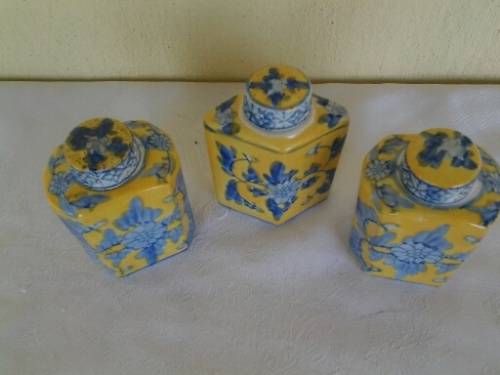 three small oriental looking decorative mini porcelain jars with lids