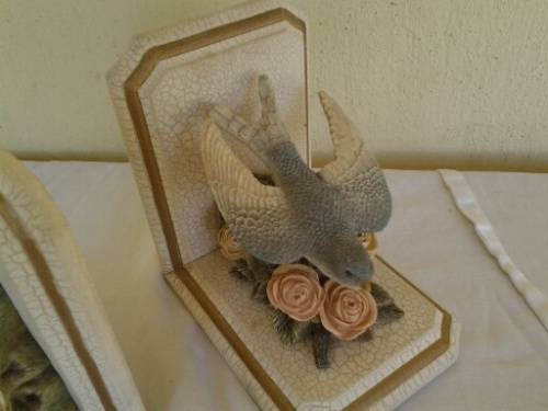 A pair of stunning bird and floral scene bookends