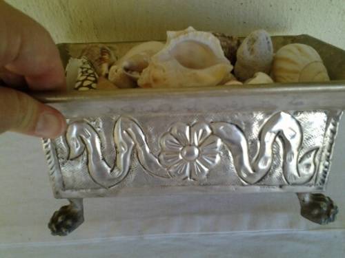 stunning sliver plated little floral pattern dish filled with sea shells