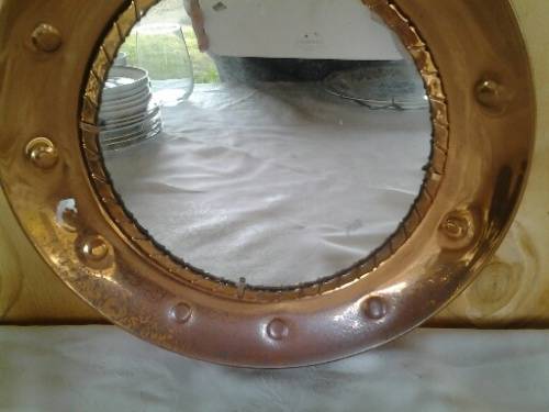 Round vintage copper wall mirror