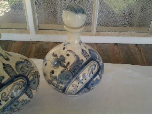 a pair of decorated blue and white porcelain decanters ? display bottles