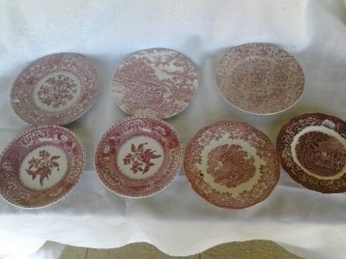 eight assorted pretty red and white porcelain side plates
