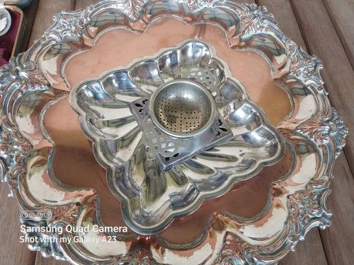 A lot of vintage sliver plated tea spoons ..tray ..tea strainer etc