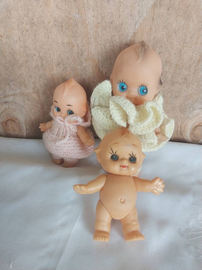Three assorted kewpie dolls