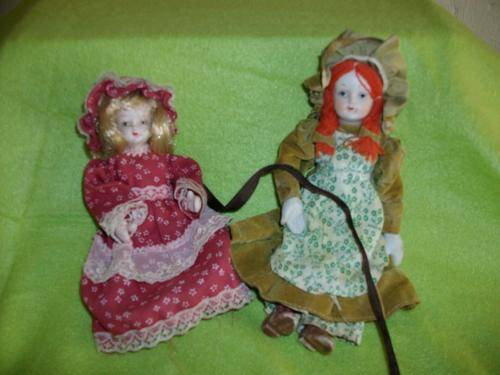 set of two old type porcelain dolls