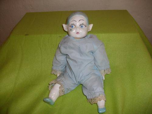 A blue pixie porcelain doll  .