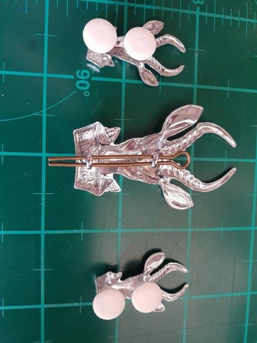 Large Chrome Bokkop and collar badges pair