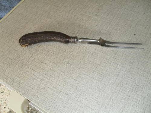 A   VINTAGE "HORN"  HANDLED CARVING FORK