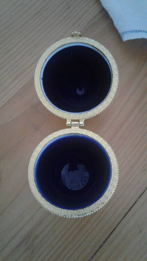 (NORR)A VINTAGE COBALT BLUE AND GOLD  PORCELAINE REPLICA HINGED FABERGE EGG with gold tone clasp.