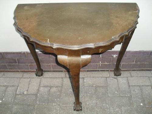 A Ball and Claw half moon table
