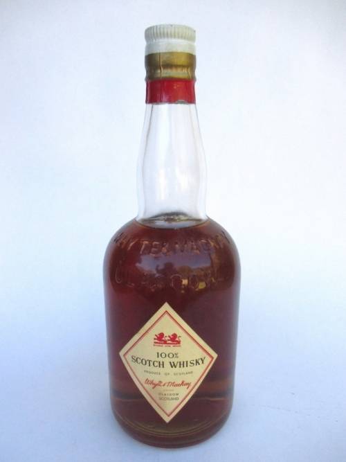 VINTAGE WHYTE & MACKAYS WHISKEY BOTTLE STILL SEALED (BAR)