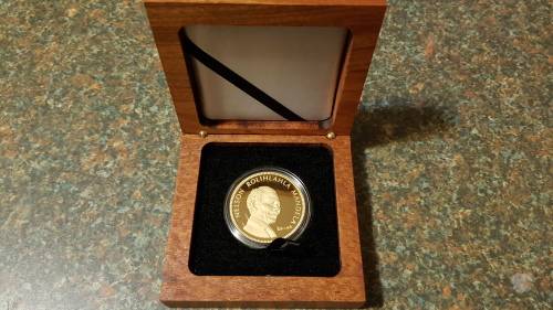 Nelson Mandela Collectors Clad gold medallion, commemorative Diary and Keychain.